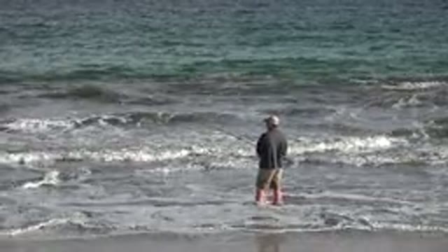 LOS CABOS MEXICO-2019: Man at Coast Looking at Ocean Waves
