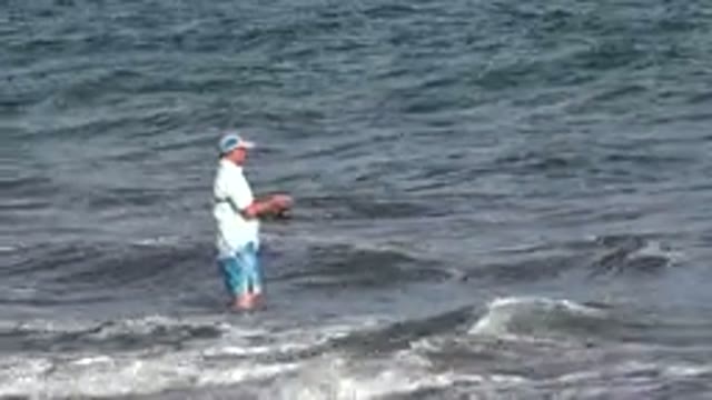 LOS CABOS MEXICO-2019: A Man Wearing A Cap Is Standing Amid The Water And Fishing