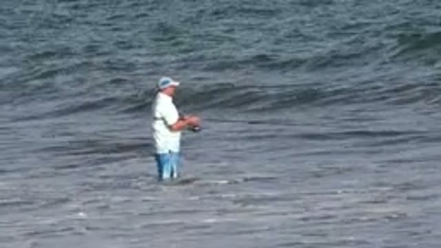 LOS CABOS MEXICO-2019: A Man Is Catching Fishes At The Large Sea On A Peaceful