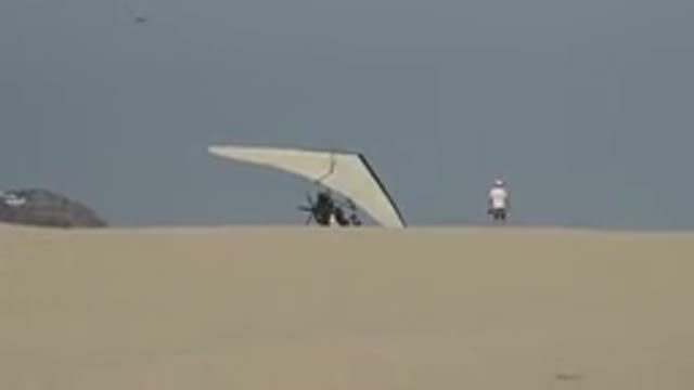 LOS CABOS MEXICO-2019: A White Hang Glider On Sand Getting Ready To Take Off