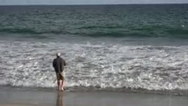 LOS CABOS MEXICO-2019: A Man On The Shore With Rough Waters And Waves At His