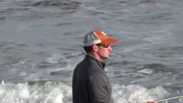 LOS CABOS MEXICO-2019: Fisherman Wearing Hat Fishing At The Beach Near The Small Waves