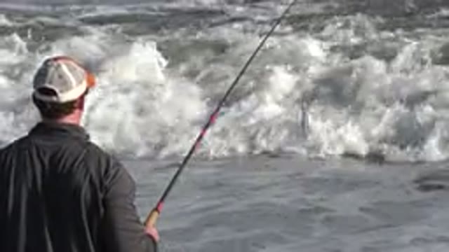 LOS CABOS MEXICO-2019: A Man Casting His Fishing Line In The Ocean