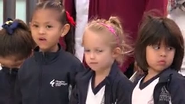 SAN JOSE DEL CABO MEXICO-2019: Four Girls Wearing Jackets Stand In A Row And Fidget In Wind