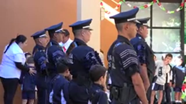 SAN JOSE DEL CABO MEXICO-2019: A Group Of Police Officers And Children At A Ceremony