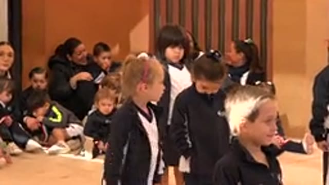 SAN JOSE DEL CABO MEXICO-2019: A Group Of Young Children Wearing Matching Jackets Playing