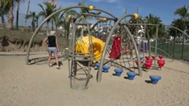 SAN JOSE DEL CABO MEXICO-2019: A Blonde Mother Playing With Her Child At The Playground