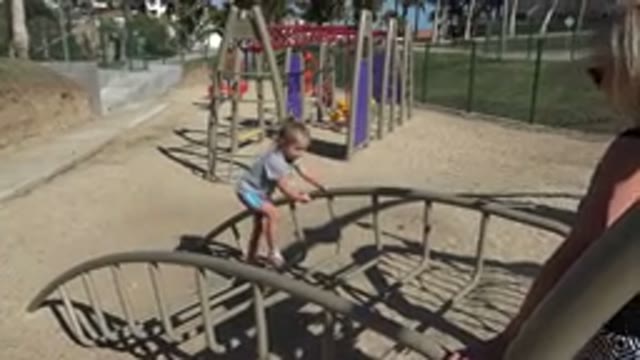 SAN JOSE DEL CABO MEXICO-2019: Child Playing On A Playground Crossing Metal Structure