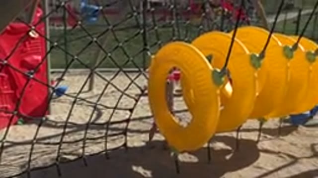 SAN JOSE DEL CABO MEXICO-2019: Young Girl Ducks Under Net In A Childrens Playground