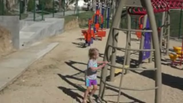 SAN JOSE DEL CABO MEXICO-2019: On A Sunny Day A Little Girl Has Fun Climbing The