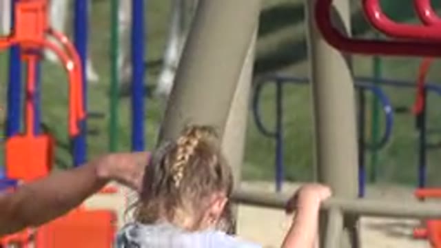 SAN JOSE DEL CABO MEXICO-2019: Woman Helps Little Girl Carefully Climb Down