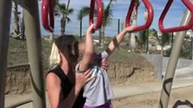 SAN JOSE DEL CABO MEXICO-2019: Mother Helping Her Daughter Play At The Park