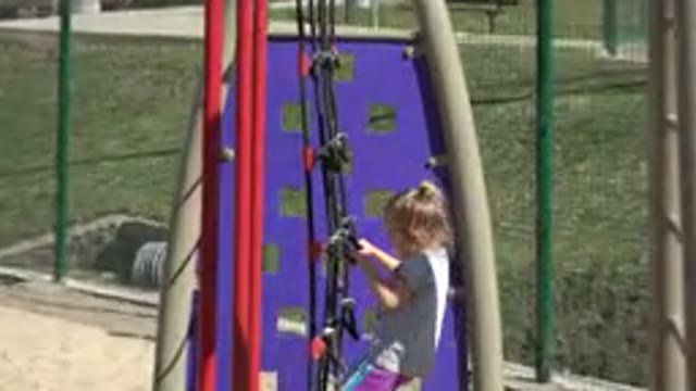 SAN JOSE DEL CABO MEXICO-2019: Little Girl Climbing A Large Net At A Play