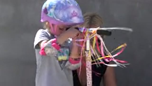 SAN JOSE DEL CABO MEXICO-2019: Dog Investigates As Little Girl Attempts To Untangle Bag