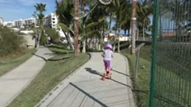 SAN JOSE DEL CABO MEXICO-2019: Little Girl Having Summertime Fun Riding Scooter