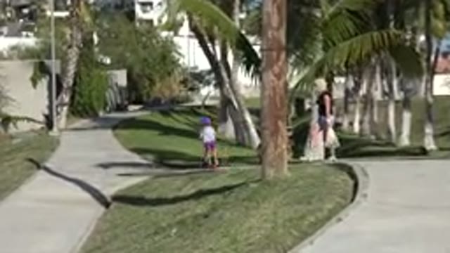 SAN JOSE DEL CABO MEXICO-2019: A Child Falls Off Of A Scooter
