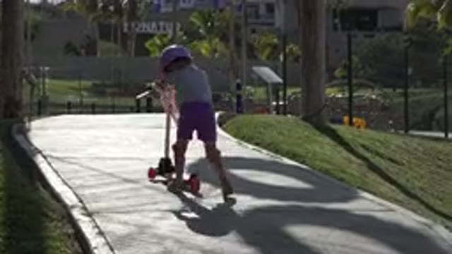 SAN JOSE DEL CABO MEXICO-2019: A Girl Rides a Scooter in a Tropical Coastal Town