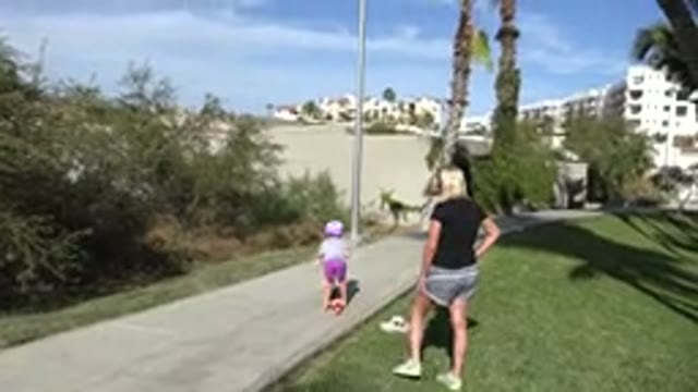 SAN JOSE DEL CABO MEXICO-2019: Mother Watching Her Daughter Learn To Ride A Scooter