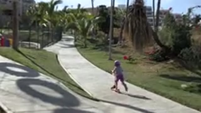 SAN JOSE DEL CABO MEXICO-2019: A Little Girl On A Scooter On An Empty Path