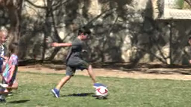 SAN JOSE DEL CABO MEXICO-2019: Many Children Having Fun Playing Football With