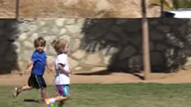 SAN JOSE DEL CABO MEXICO-2019: Four Children Running On A Grass Field