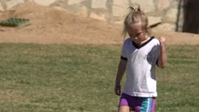 SAN JOSE DEL CABO MEXICO-2019: Little Girl Walking Alone On A Soccer Field