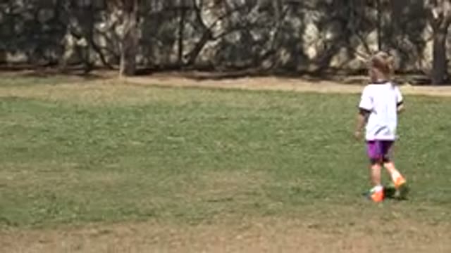 SAN JOSE DEL CABO MEXICO-2019: Children Playing Tennis on Grass Field with Trees