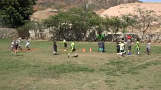 SAN JOSE DEL CABO MEXICO-2019: Coach Watching Kids Playing Soccer In A Field On