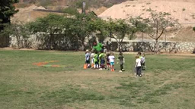 SAN JOSE DEL CABO MEXICO-2019: Soccer Coach Gathering Players Around For A