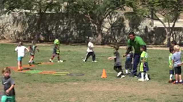SAN JOSE DEL CABO MEXICO-2019: Multiple Kids Being Trained On A Field By A Coach