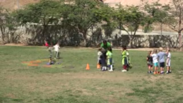 SAN JOSE DEL CABO MEXICO-2019: Teacher Showing A Game To Kids In A Park Which Is