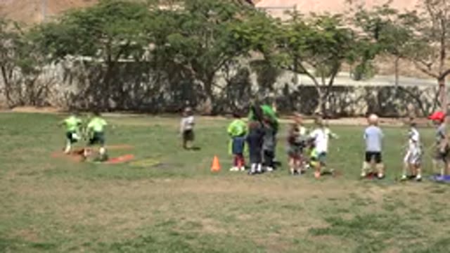 SAN JOSE DEL CABO MEXICO-2019: Small Children Run Drills On A Sports Field Under