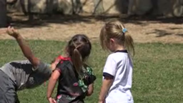 SAN JOSE DEL CABO MEXICO-2019: A Boy And Two Girls Playing In An Open Space