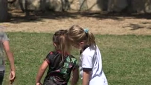 SAN JOSE DEL CABO MEXICO-2019: Children Boys Girls T Shirt Shorts Field Grass