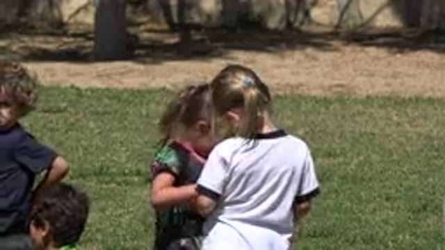SAN JOSE DEL CABO MEXICO-2019: Children Interact In The Grass As Their Friends Play