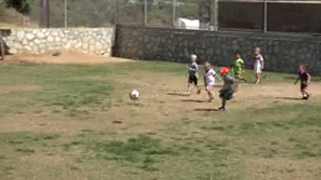 SAN JOSE DEL CABO MEXICO-2019: Little Boys Playing Soccer In A Field Supervised