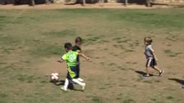SAN JOSE DEL CABO MEXICO-2019: Small Child Kicking the Soccer Ball Away From the
