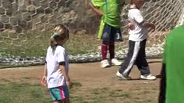 SAN JOSE DEL CABO MEXICO-2019: Little Girl Playing Soccer Running On The Grass