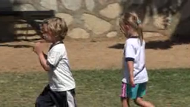 SAN JOSE DEL CABO MEXICO-2019: Kids Dressed In T-Shirts And Shorts Walk In