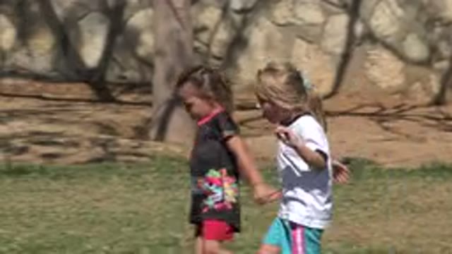 SAN JOSE DEL CABO MEXICO-2019: Blonde Little Girl Entertaining Her Friend With Chitchat