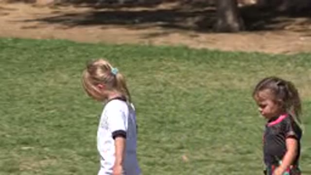 SAN JOSE DEL CABO MEXICO-2019: Two Little Kids Girls Walking Through The Yard Of