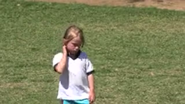 SAN JOSE DEL CABO MEXICO-2019: Child Walking With Other Child Scratches Neck
