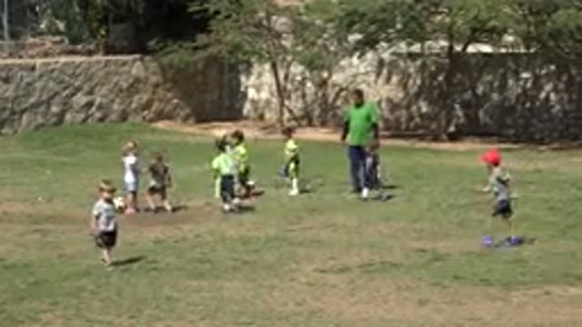 SAN JOSE DEL CABO MEXICO-2019: Very Young Children Are Playing Soccer On The Lawn