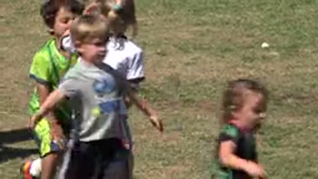 SAN JOSE DEL CABO MEXICO-2019: Children Playing Soccer Outdoors In A Loose And Uncoordinated Group