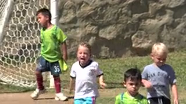 SAN JOSE DEL CABO MEXICO-2019: Blonde Child Running And Playing Soccer On A