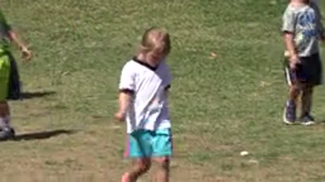 SAN JOSE DEL CABO MEXICO-2019: Small Children Walking Outdoors in a Grassy Field