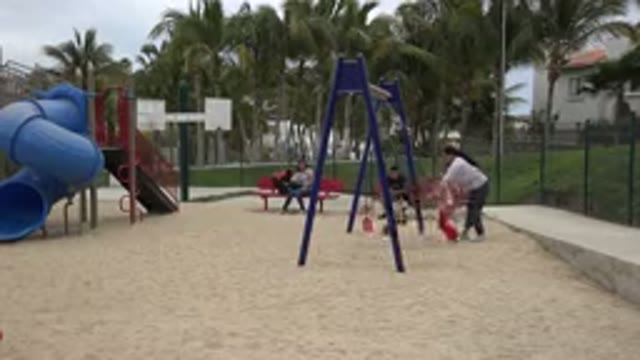 SAN JOSE DEL CABO MEXICO-2019: Children Have Fun On The Swing At The Playground