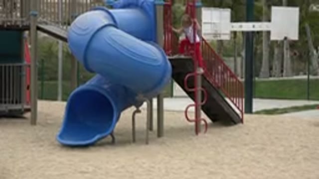 SAN JOSE DEL CABO MEXICO-2019: Cute Blond Girl Wearing Her Red Pants To The Playground