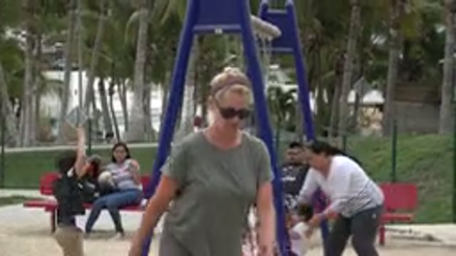 SAN JOSE DEL CABO MEXICO-2019: Woman Wearing Sunglasses Walks Towards Camera And
