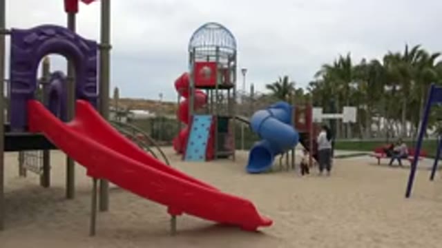 SAN JOSE DEL CABO MEXICO-2019: A Mom And A Child At A Playground With Sand On